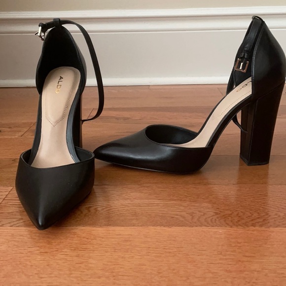 Black, genuine leather point toe block heels.